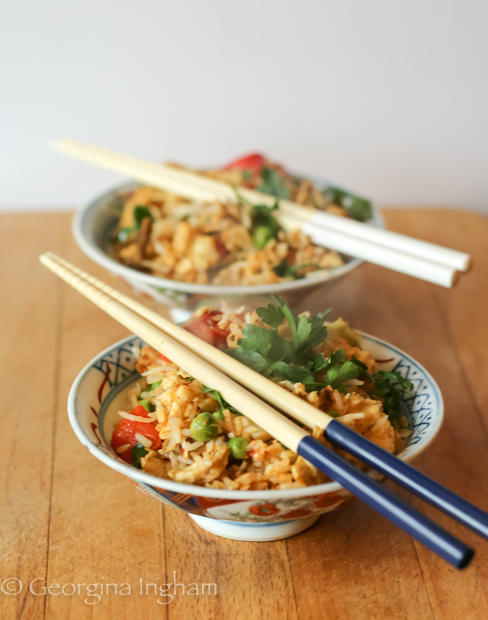 Homemade Yangzhou fried rice, also known as Yeung Chow fried rice, served in a bowl with chopsticks